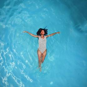 Instagram post template featuring woman floating freely in water
